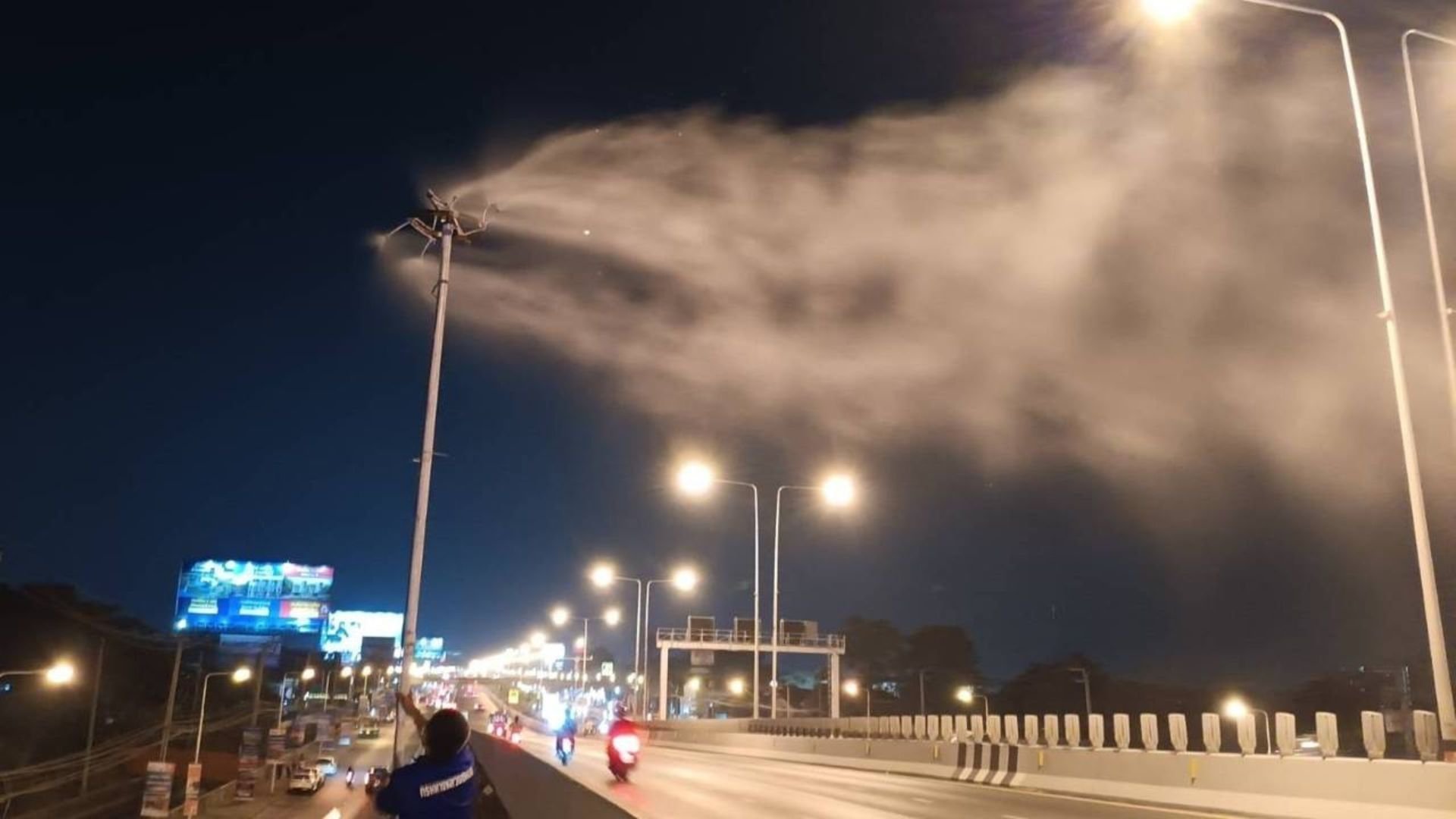 Water sprayers installed on bridges in Bangkok to disperse airborne dust