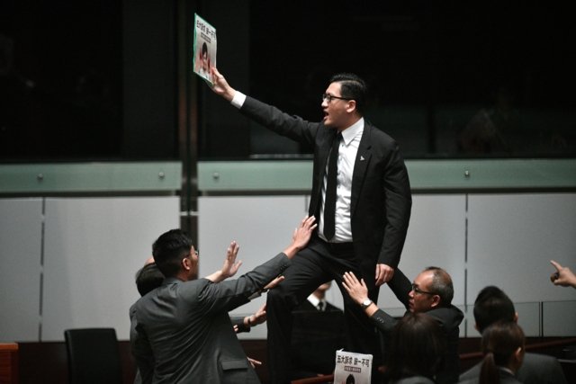 Two Hong Kong opposition lawmakers arrested over protests Two Hong Kong opposition lawmakers arrested over protests