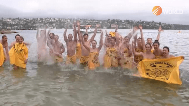 Hundreds of nude swimmers take the plunge in Sydney Harbour