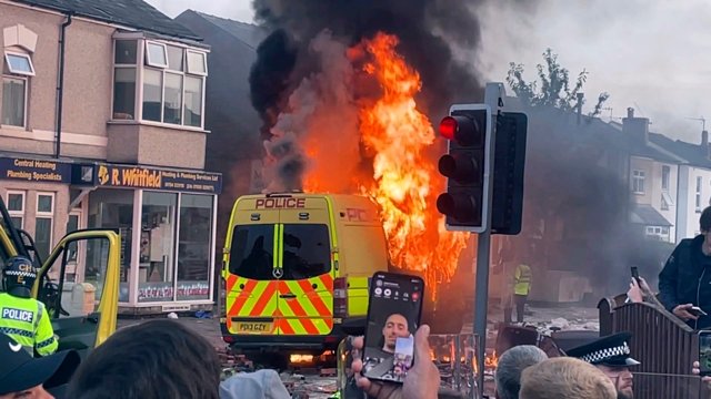 Police clash with a violent crowd gathered near the site of UK stabbing attack that killed 3 girls