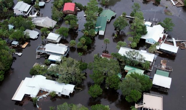 Hurricane Idalia hits Florida with 125 mph winds, flooding streets, snapping trees and cutting power