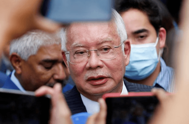 Former Malaysian PM Najib Razak’s jail term halved to 6 years in royal pardon Former Malaysian PM Najib Razak’s jail term halved to 6 years in royal pardon