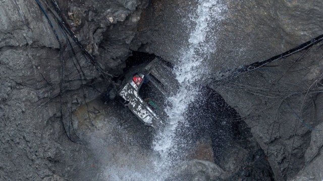 Emergency team rescued after trying to salvage car from deep sinkhole Emergency team rescued after trying to salvage car from deep sinkhole