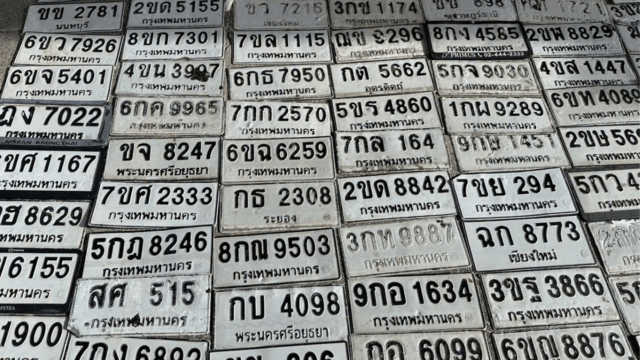 Motorists search for licence plates swept away by floodwaters