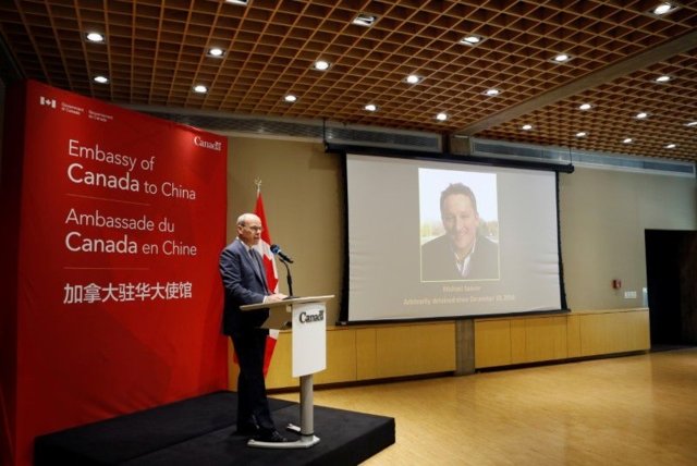 China court convicts Canadian to 11 years in prison in espionage case China court convicts Canadian to 11 years in prison in espionage case