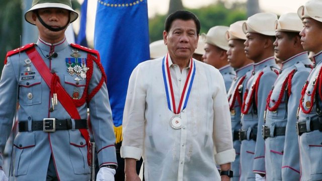 Duterte says he is 'responsible' as ICC takes him into custody Duterte says he is 'responsible' as ICC takes him into custody