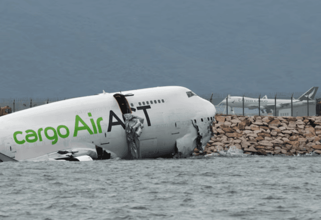 Cargo plane slides off runway in Hong Kong, media reports two dead Cargo plane slides off runway in Hong Kong, media reports two dead
