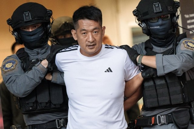 Chinese cybercrime boss She Zhijiang extradited to China Chinese cybercrime boss She Zhijiang extradited to China