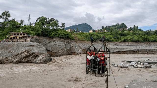 Trading food for medicine and crossing the river by zip line are part of life in Nepal flood zone Trading food for medicine and crossing the river by zip line are part of life in Nepal flood zone